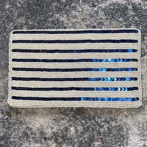 Blue and cream sequence clutch